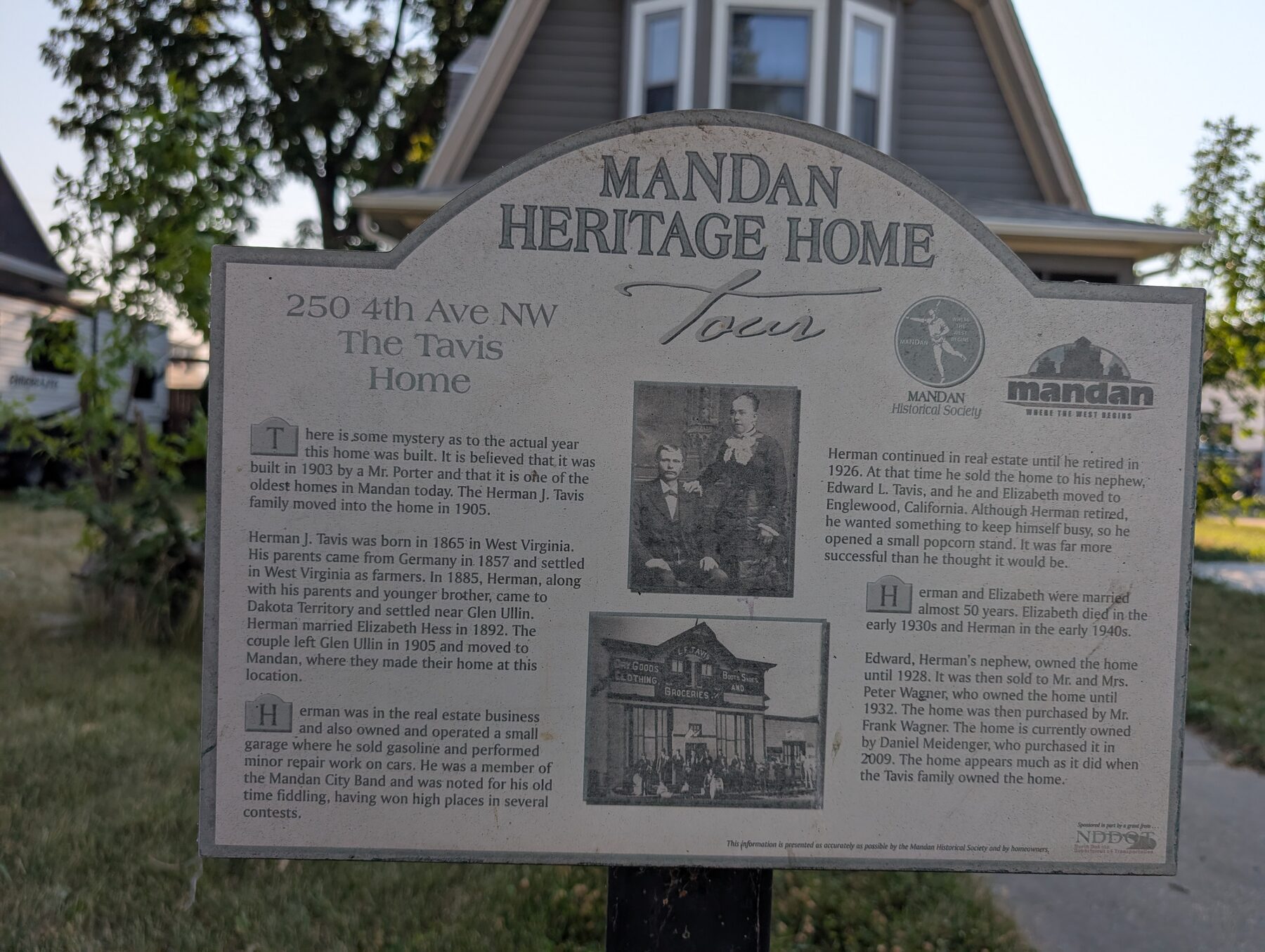 The Tavis Home heritage sign in front of the house
